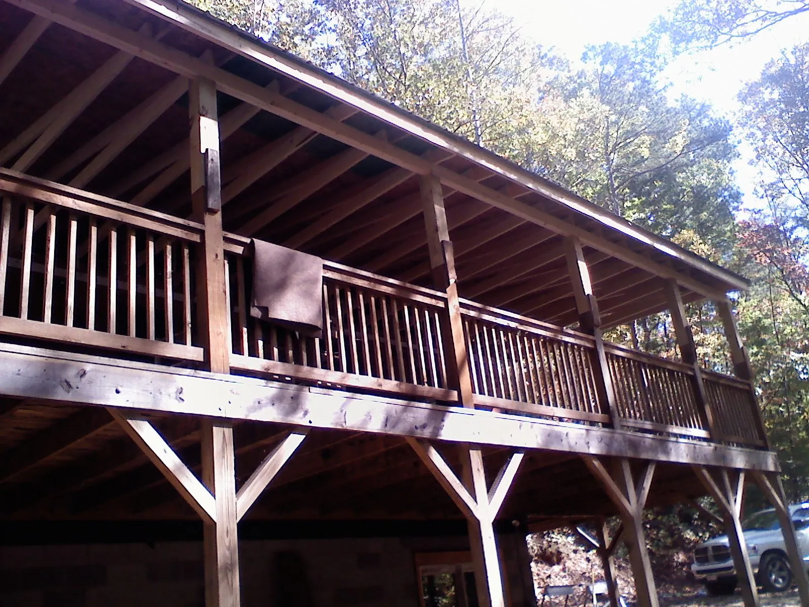 Timber framing under a new elevated porch and deck — Roof Leak Repair in Del Valle by Roofing Brothers